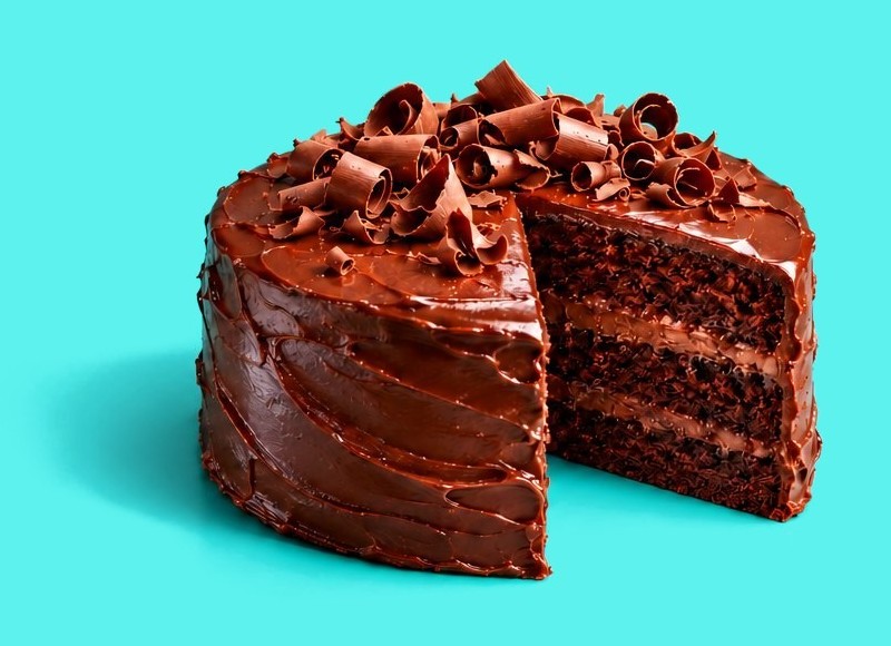 A chocolate cake with a slice cut out