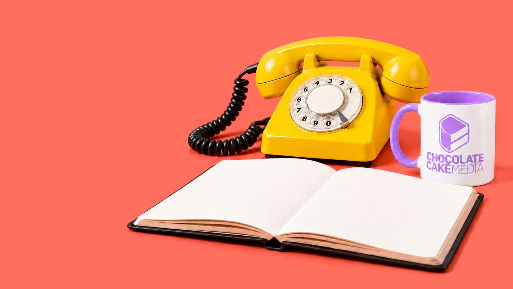 Yellow phone, open notebook and CCM mug
