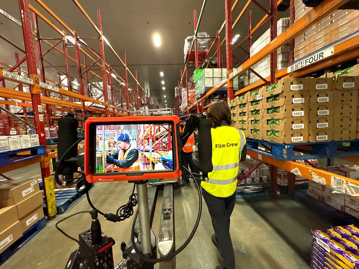 Checking the shot in a distribution centre aisle