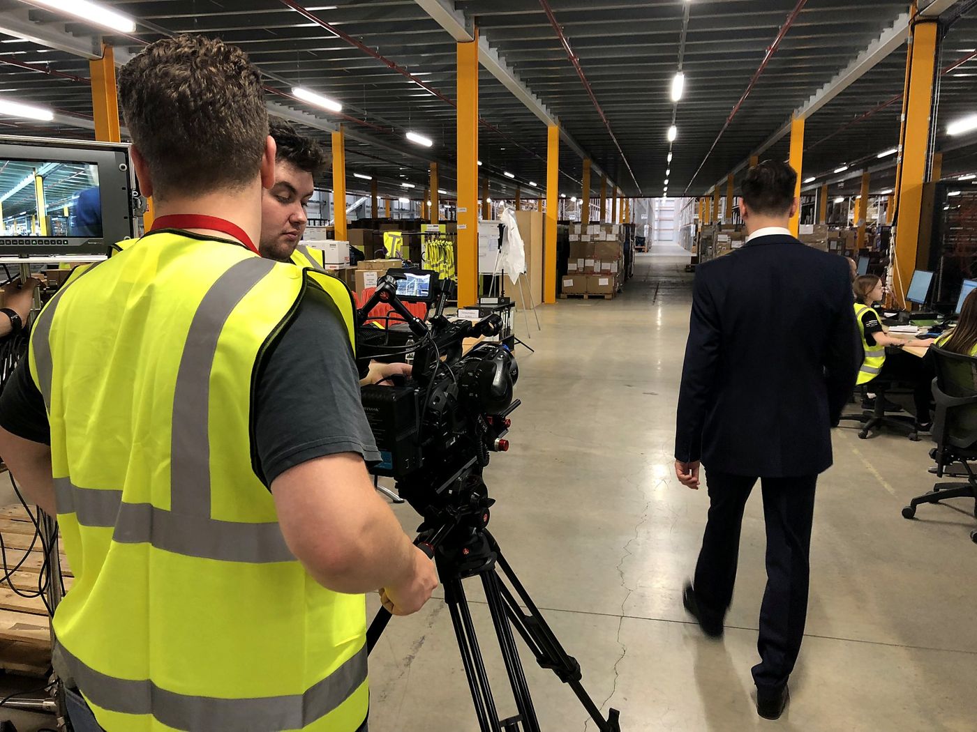 Following the action on a warehouse floor